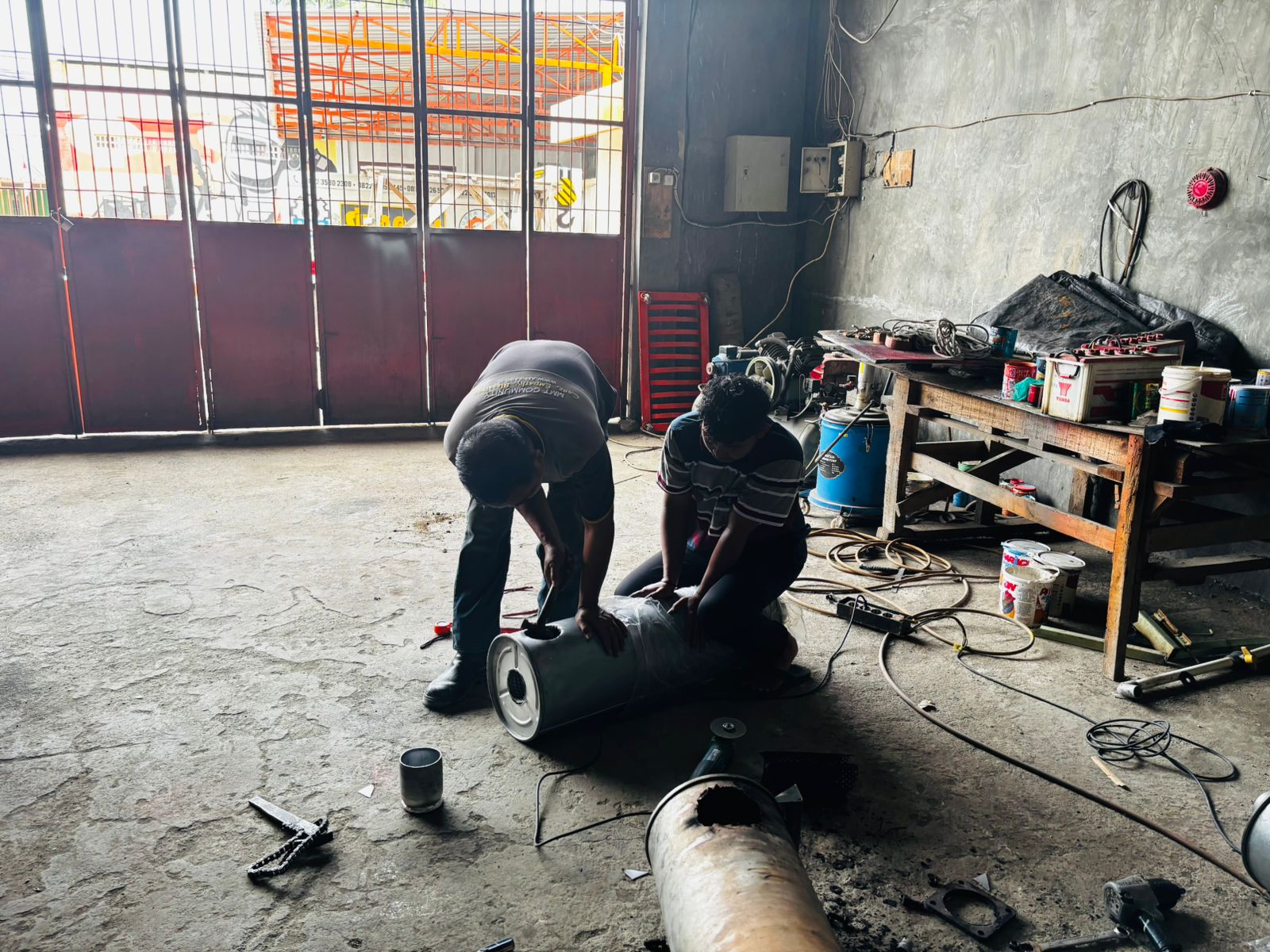 JASA REKONDISI PENGELASAN KNALPOT GENSET KONSTUMER GORONTALO
